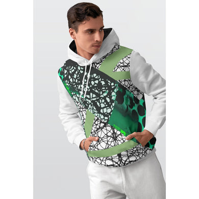 Man wearing a white hoodie with green and black abstract patterns on a light gray background